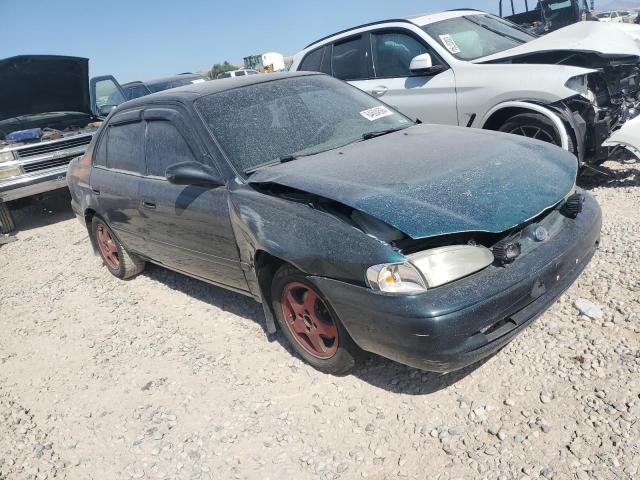 1Y1SK5282XZ423120 - 1999 CHEVROLET GEO PRIZM BASE GREEN photo 4