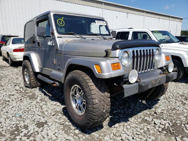 1J4FA49S21P347612 - 2001 JEEP WRANGLER SPORT SILVER photo 4