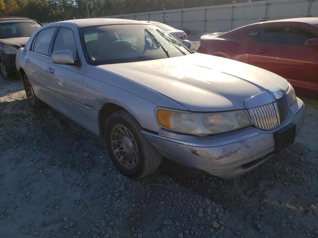 1LNFM82W4XY604026 - 1999 LINCOLN TOWN CAR SIGNATURE SILVER photo 1