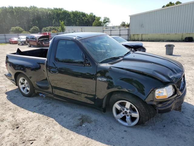 2FTZF07382CA57418 - 2002 FORD F150 SVT LIGHTNING BLACK photo 4