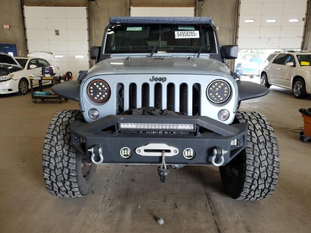 1C4BJWEG4CL162747 - 2012 JEEP WRANGLER U SAHARA ლურჯი ფოტო 5