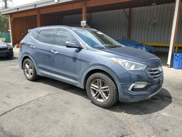 5NMZUDLB2HH014994 - 2017 HYUNDAI SANTA FE S BLUE photo 4