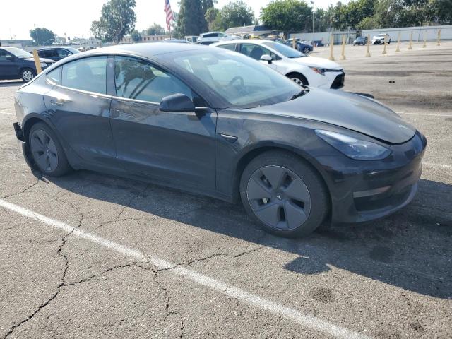 5YJ3E1EA0PF432217 - 2023 TESLA MODEL 3 Schwarz Foto 4