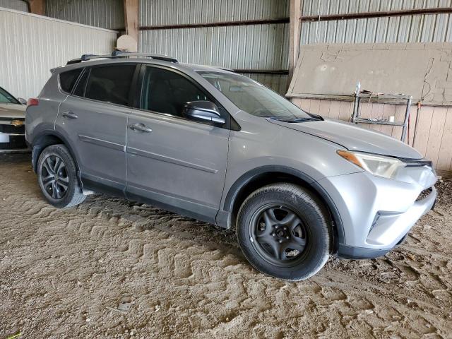 2T3ZFREVXGW285102 - 2016 TOYOTA RAV4 LE SILVER photo 4