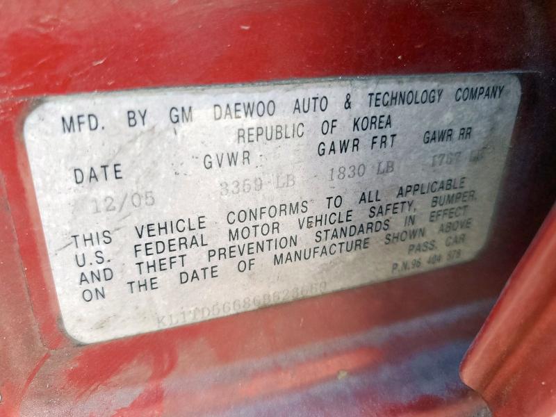 KL1TD56686B623669 - 2006 CHEVROLET AVEO BASE Czerwony zdjęcie 13