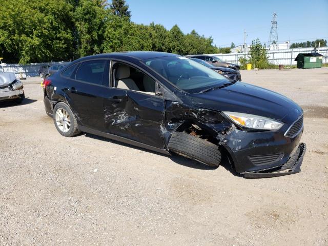 1FADP3F23FL351697 - 2015 FORD FOCUS SE BLACK photo 4