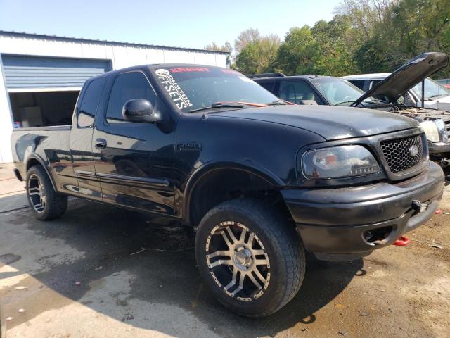 1FTRX18L4YNC27827 - 2000 FORD F150 BLACK photo 4