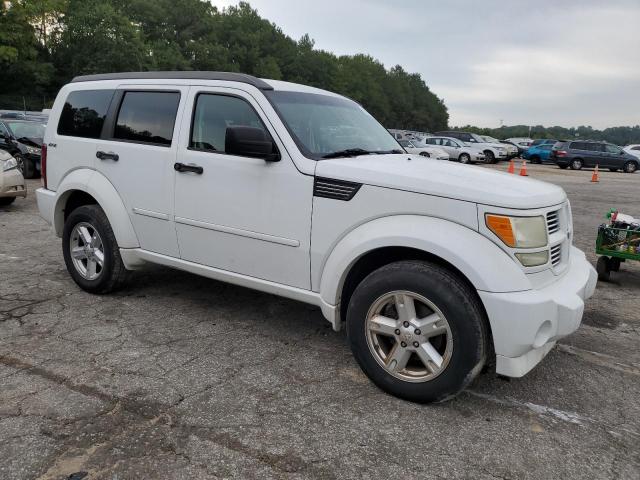 1D4PU5GK8BW565056 - 2011 DODGE NITRO SXT WHITE photo 4