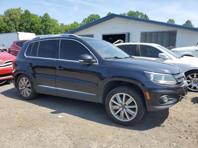 WVGBV3AX8EW532247 - 2014 VOLKSWAGEN TIGUAN S BLACK photo 4