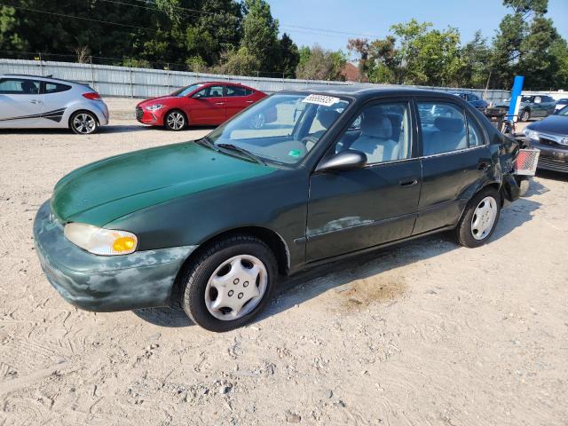 1Y1SK5284YZ411021 - 2000 CHEVROLET GEO PRIZM BASE GREEN photo 1