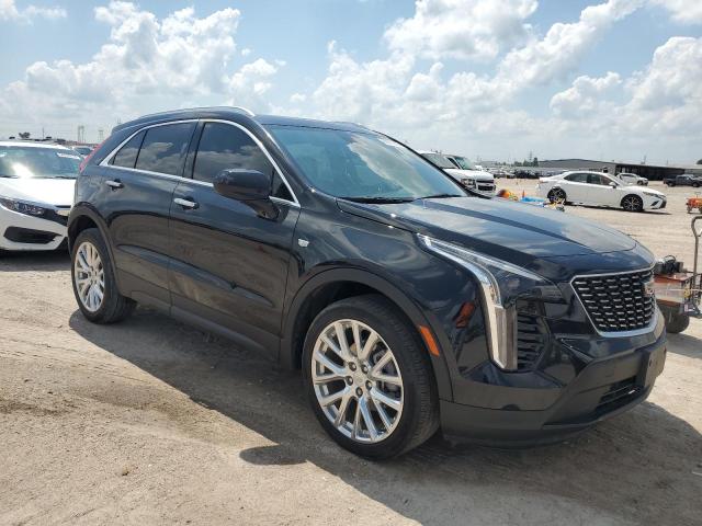 1GYAZAR40PF106567 - 2023 CADILLAC XT4 LUXURY BLACK photo 4