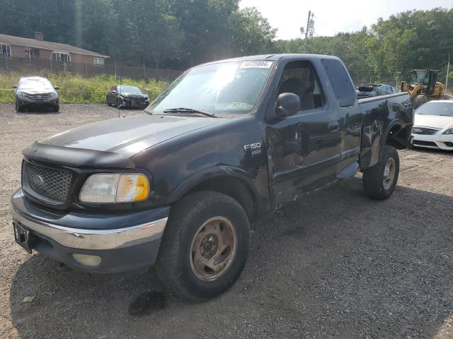 1FTRX18L0YNC24441 - 2000 FORD F150 BLACK photo 1