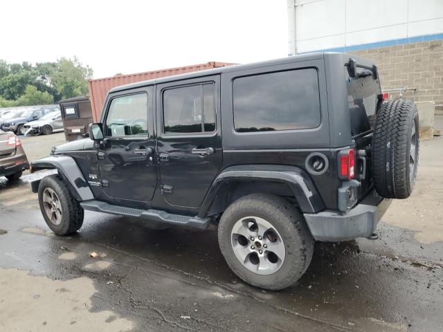 1C4BJWEG6GL323380 - 2016 JEEP WRANGLER U SAHARA BLACK photo 2