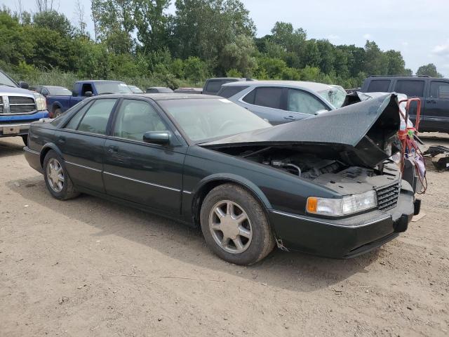 1G6KY5294VU833913 - 1997 CADILLAC SEVILLE STS GREEN photo 4