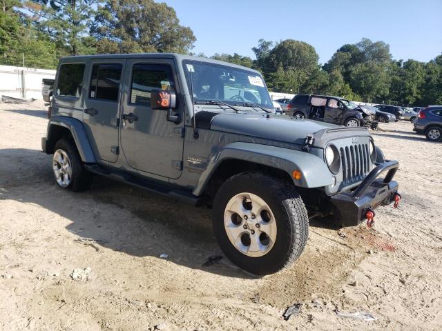 1C4BJWEG7EL146402 - 2014 JEEP WRANGLER U SAHARA BLUE photo 4