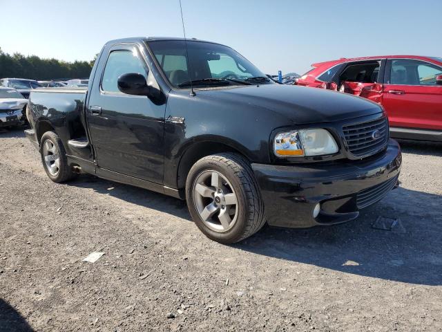 2FTZF07361CA46898 - 2001 FORD F150 SVT LIGHTNING BLACK photo 4