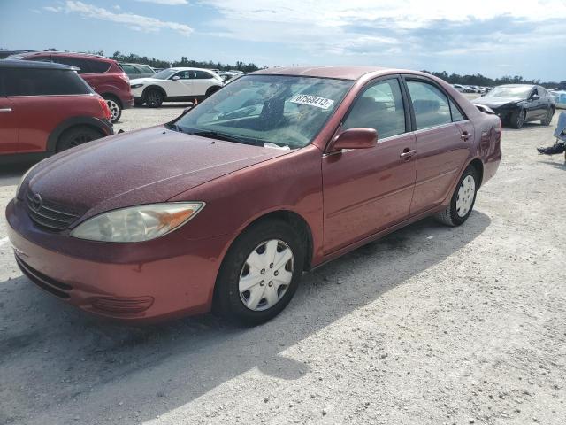 JTDBE32K320009742 - 2002 TOYOTA CAMRY LE RED photo 1