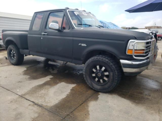 1FTEX14Y8NKA86886 - 1992 FORD F150 BLACK photo 4