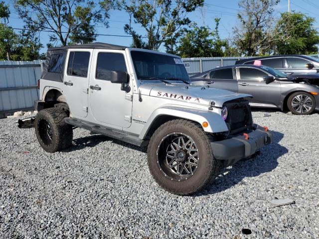 1C4BJWEG5CL254417 - 2012 JEEP WRANGLER UNLIMITED SAHARA Silber Foto 4