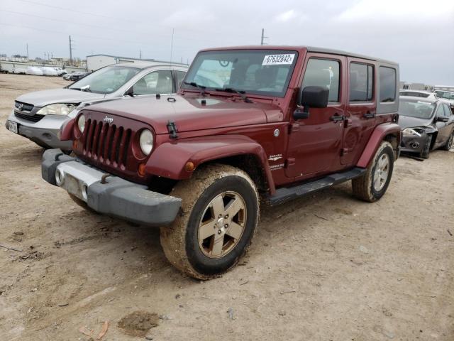 1J4GA59189L762812 - 2009 JEEP WRANGLER U SAHARA RED photo 1