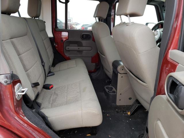 1J4GA59189L762812 - 2009 JEEP WRANGLER U SAHARA RED photo 10