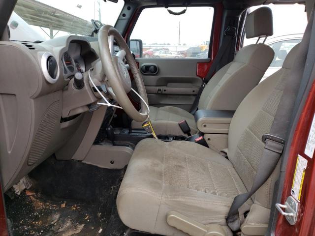 1J4GA59189L762812 - 2009 JEEP WRANGLER U SAHARA RED photo 7
