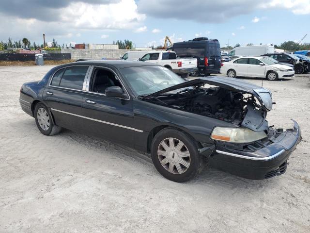 1LNHM84W94Y668855 - 2004 LINCOLN TOWN CAR EXECUTIVE L BLACK photo 4