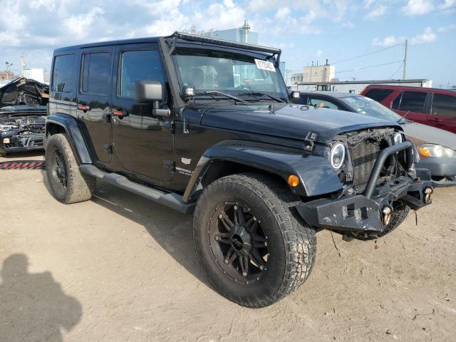 1J4HA7H11BL610264 - 2011 JEEP WRANGLER U JEEP 70TH ANNIVERSARY BLACK photo 4