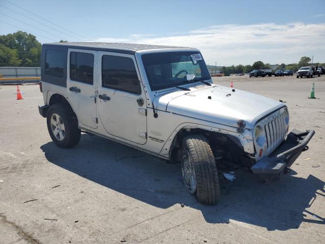 1J4BA5H12AL220105 - 2010 JEEP WRANGLER U SAHARA SILVER photo 4