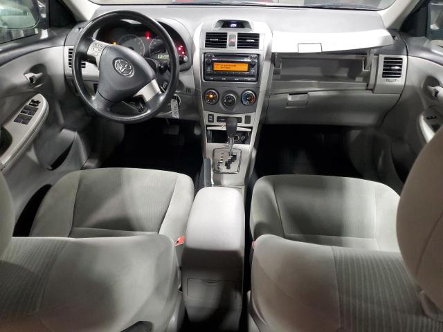 5YFBU4EE1CP055303 - 2012 TOYOTA COROLLA BASE Schwarz Foto 8