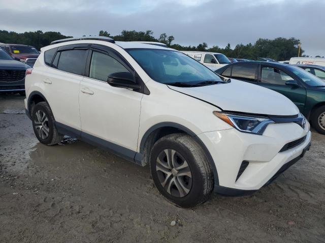 JTMBFREV4GD196690 - 2016 TOYOTA RAV4 LE WHITE photo 4