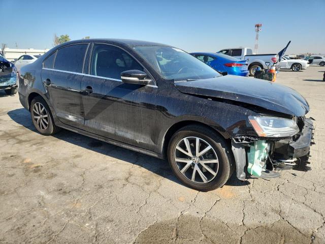 3VWDB7AJ0HM388039 - 2017 VOLKSWAGEN JETTA SE BLACK photo 4