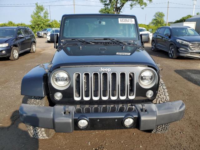 1C4BJWEG1GL262374 - 2016 JEEP WRANGLER U SAHARA შავი ფოტო 5
