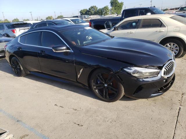 WBAGV8C08LCE52579 - 2020 BMW M850XI BLACK photo 4