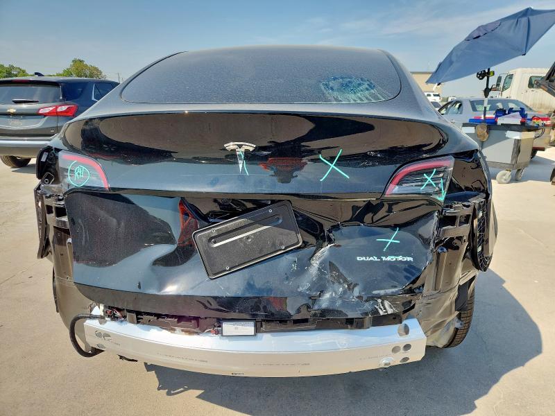 7SAYGAEE2SF302261 - 2025 TESLA MODEL Y Schwarz Foto 6