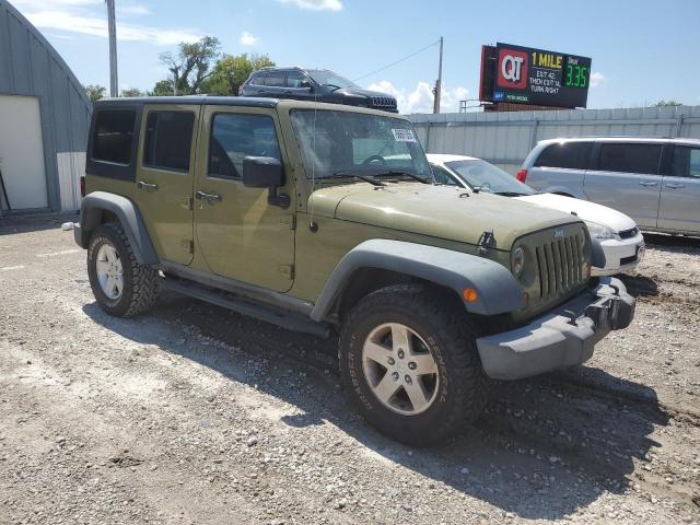 1C4HJWDG3DL543762 - 2013 JEEP WRANGLER UNLIMITED SPORT Grün Foto 4