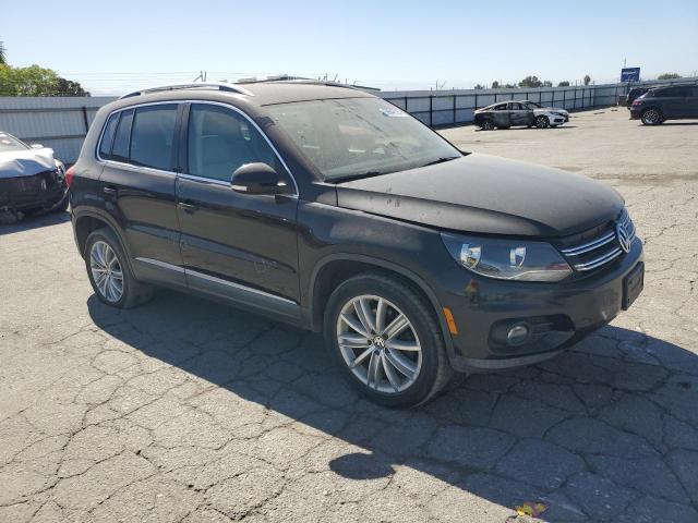 WVGAV3AX5EW550118 - 2014 VOLKSWAGEN TIGUAN S BLACK photo 4