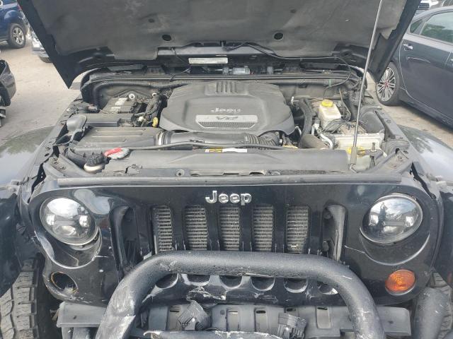 1C4BJWEG2CL209421 - 2012 JEEP WRANGLER UNLIMITED SAHARA შავი ფოტო 12