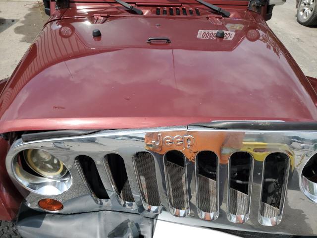 1J4HA5H14AL197047 - 2010 JEEP WRANGLER U SAHARA BURGUNDY photo 12