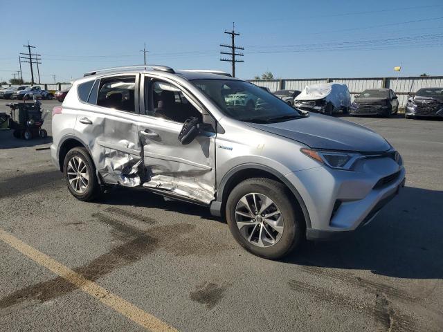 JTMRJREV6JD201148 - 2018 TOYOTA RAV4 HV LE Silber Foto 4