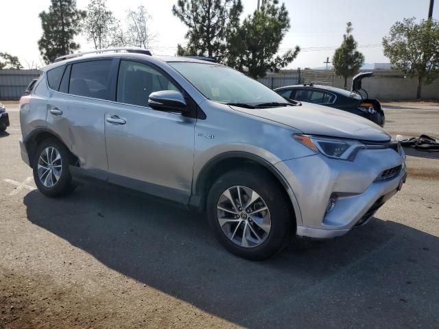 JTMRJREV9JD189092 - 2018 TOYOTA RAV4 HV LE SILVER photo 4