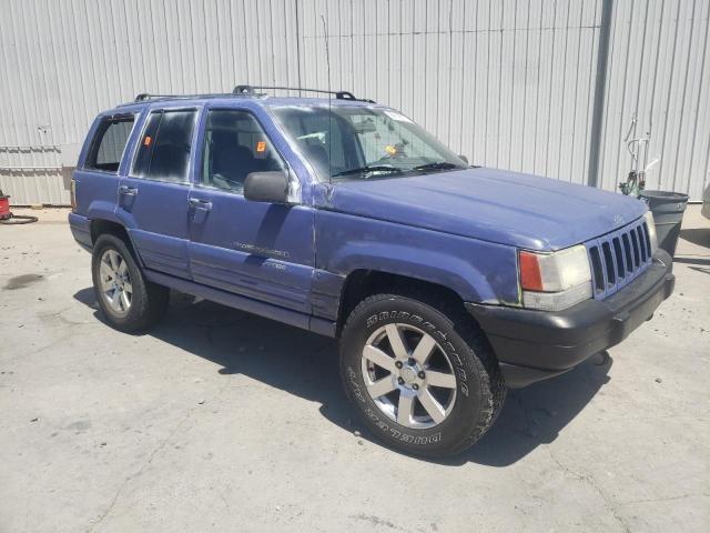 1J4GZ58S2VC561372 - 1997 JEEP GRAND CHER LAREDO Синій фото 4