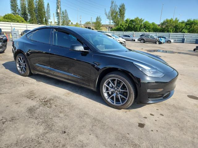 5YJ3E1EA3PF665797 - 2023 TESLA MODEL 3 Schwarz Foto 4
