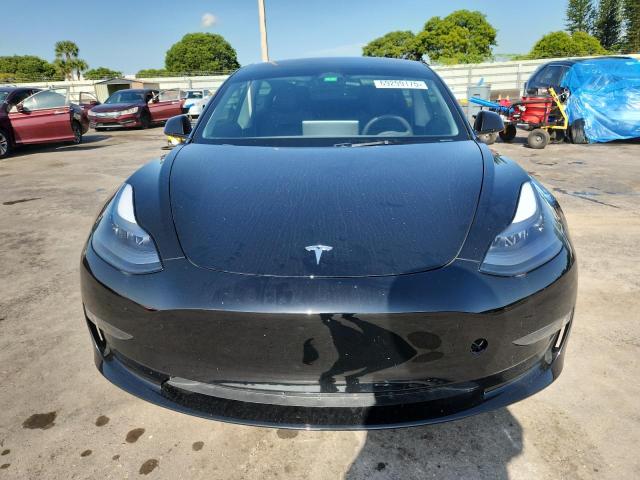 5YJ3E1EA3PF665797 - 2023 TESLA MODEL 3 Schwarz Foto 5