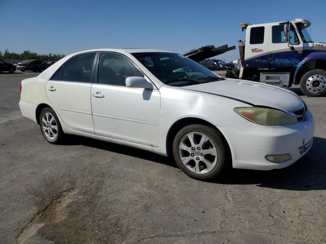 JTDBE32K140263114 - 2004 TOYOTA CAMRY LE WHITE photo 4