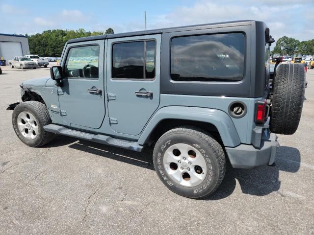 1C4BJWEG2EL292951 - 2014 JEEP WRANGLER U SAHARA GRAY photo 2