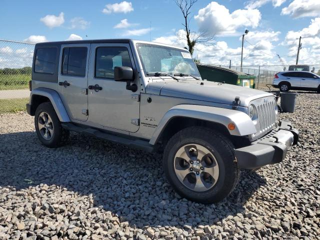 1C4BJWEG4GL239574 - 2016 JEEP WRANGLER U SAHARA SILVER photo 4
