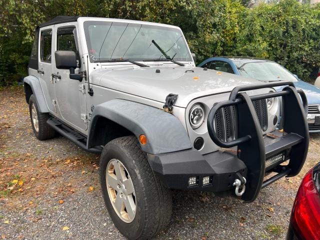 1J4HA3H16BL500982 - 2011 JEEP WRANGLER U SPORT فضي صورة 1