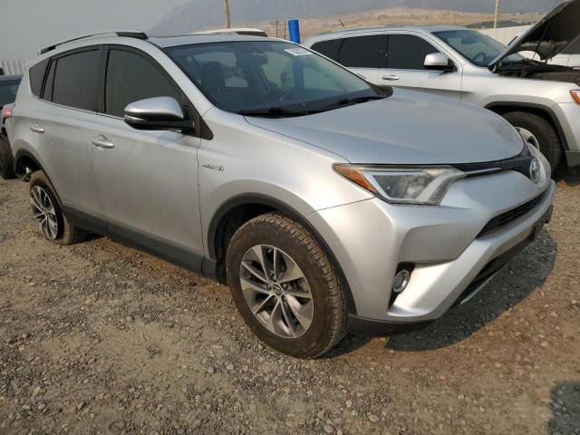 JTMRJREV3GD054876 - 2021 TOYOTA RAV4 HV XLE SILVER photo 4