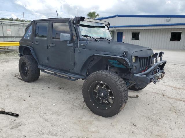 1J4BA5H10AL144027 - 2010 JEEP WRANGLER U SAHARA BLACK photo 4